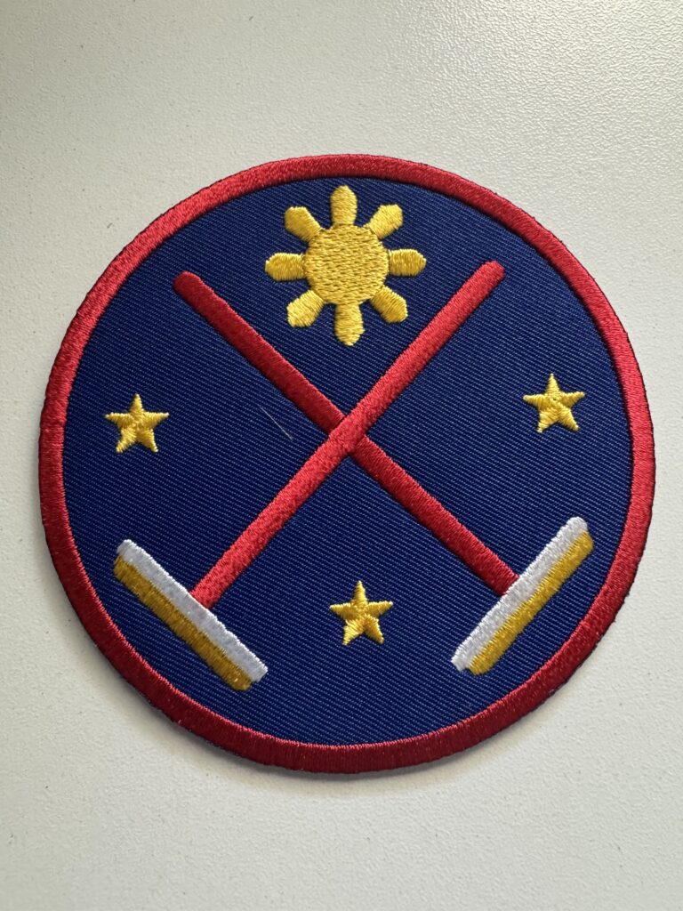 Crossed brooms patch